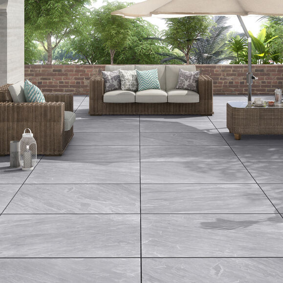 Kandla Grey porcelain paving on a garden terrace