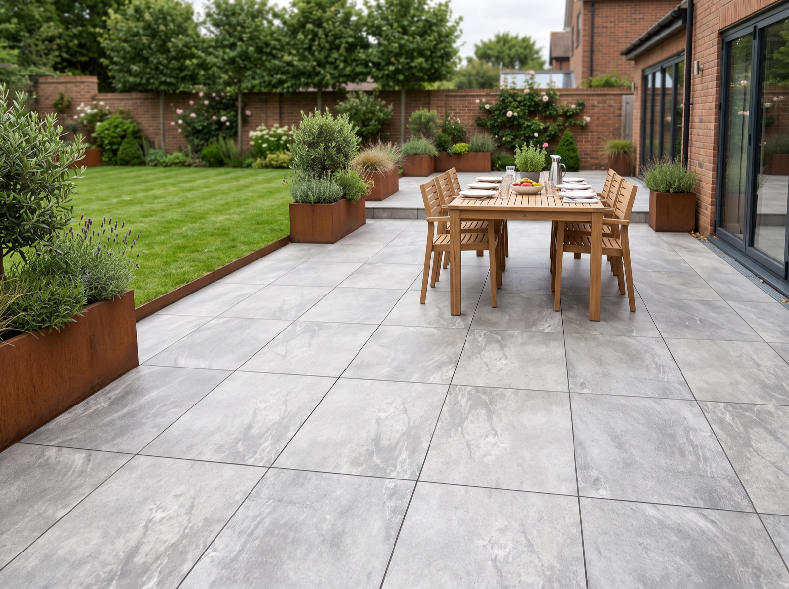 Earthcore Grey Outdoor Porcelain Paving Slabs – 900×600 shown laid in a garden setting