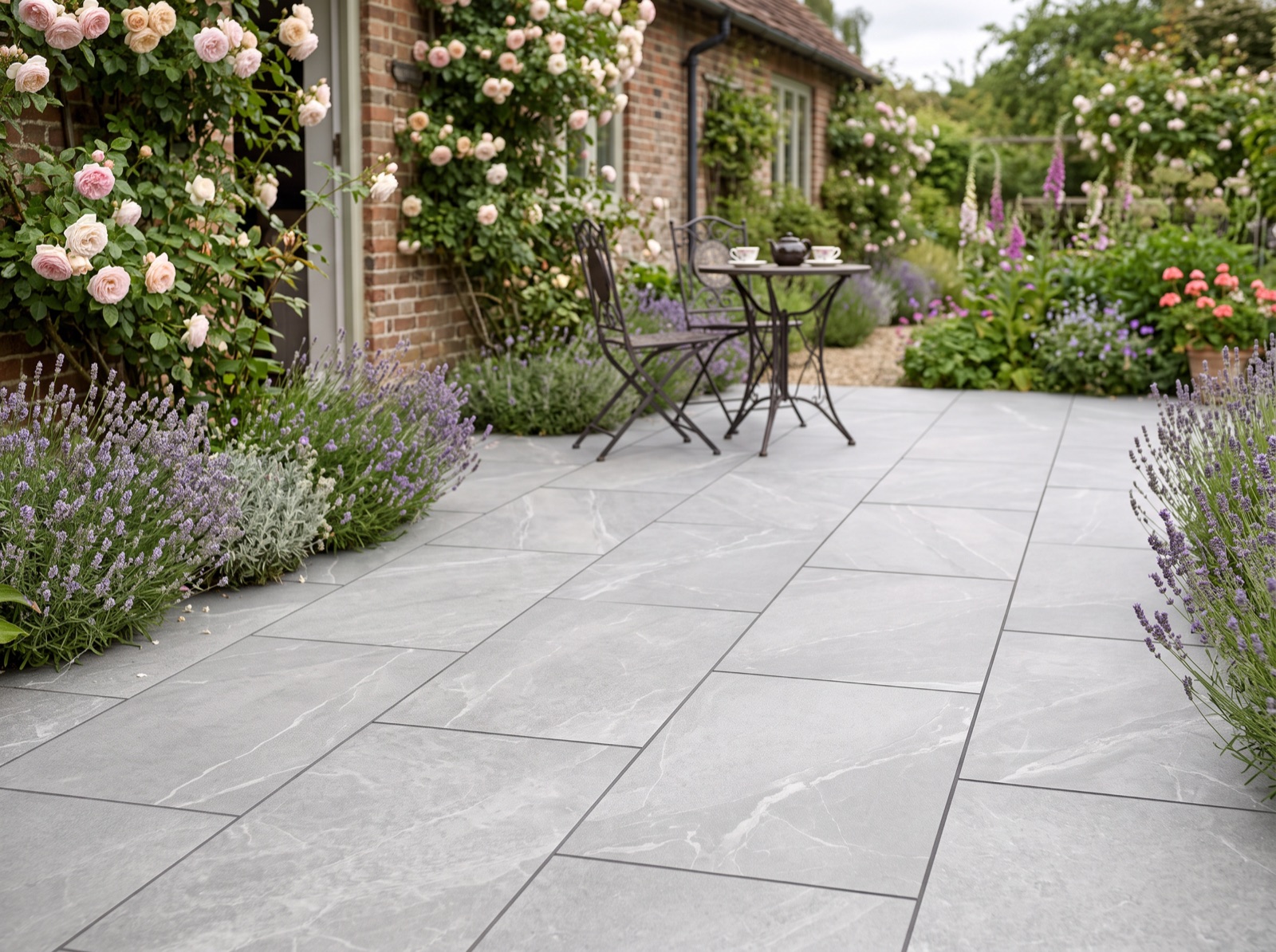 Getafe Grey Outdoor Porcelain Paving Slabs – 900×600 shown laid in a garden setting